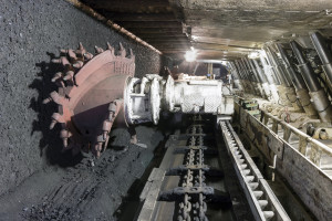 Longwall Mining: Shearer, with two rotating cutting drums and movable hydraulic powered roof supports called shields.